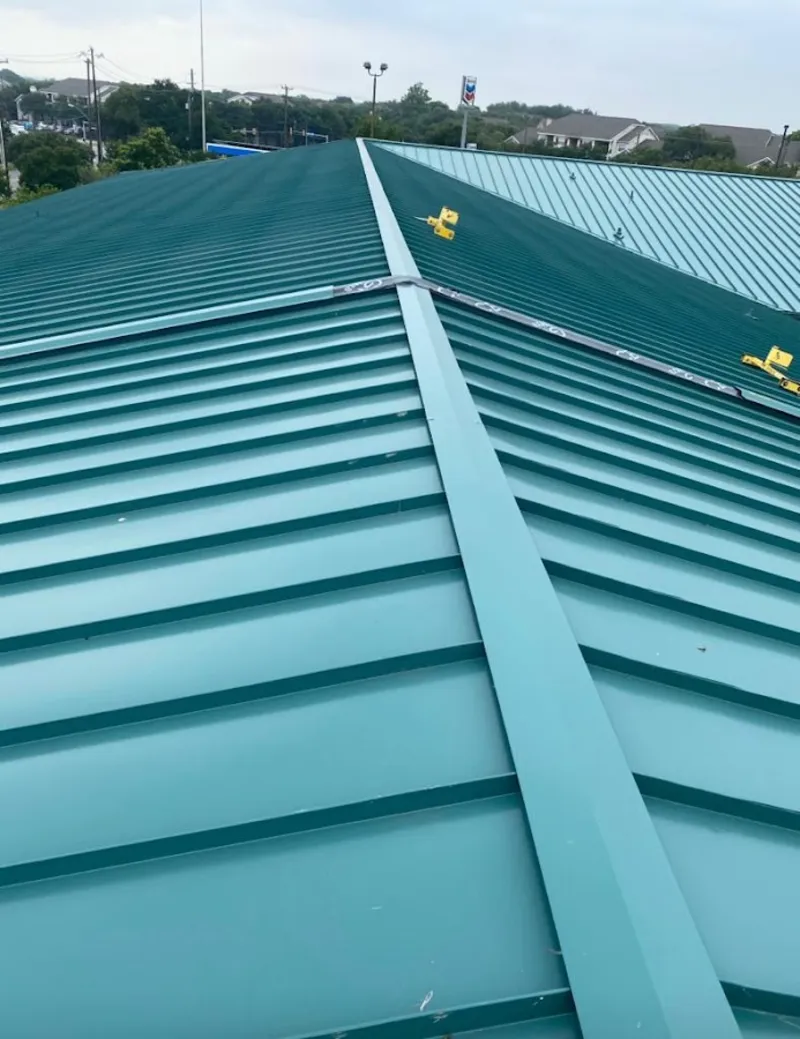 Green commercial metal roof ridge and valley for Metal Roof Repair in Goshen